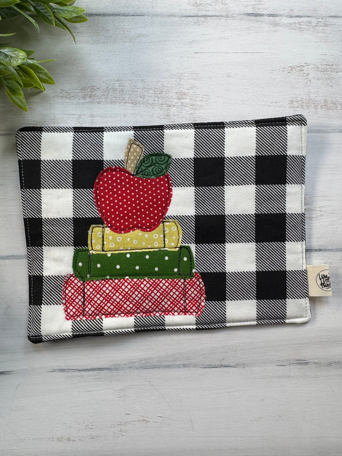 Apple on book stack mug rug