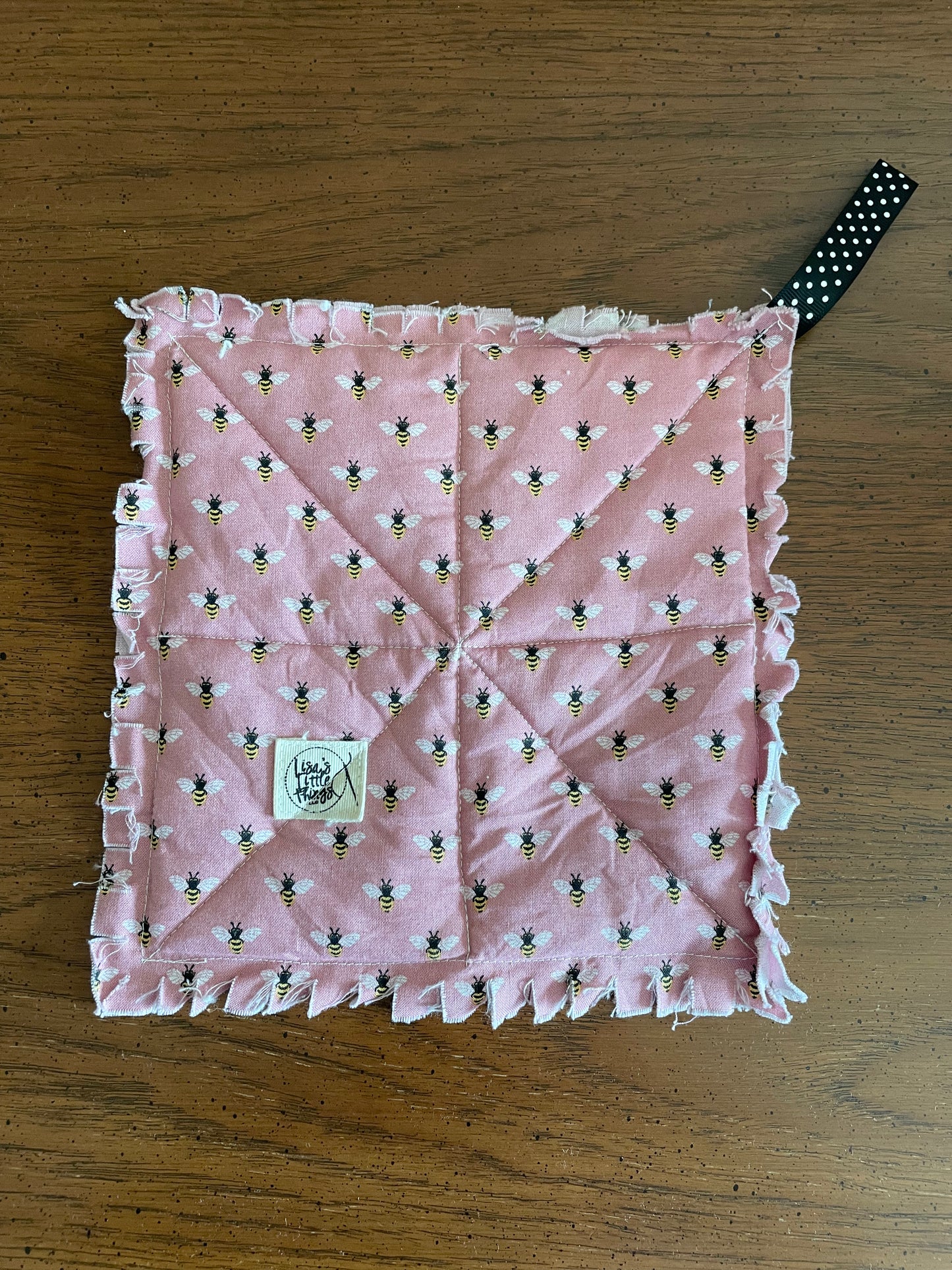 Bees on mauve potholder