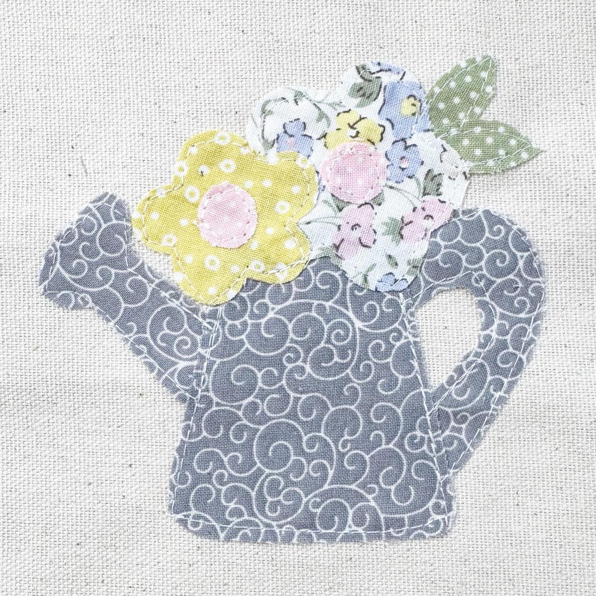 Watering can with flowers applique pattern