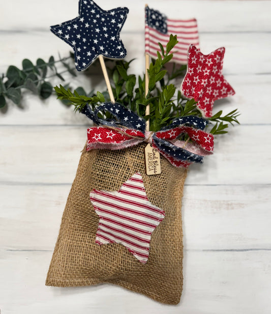 Burlap patriotic pocket with stars, flag, & greenery