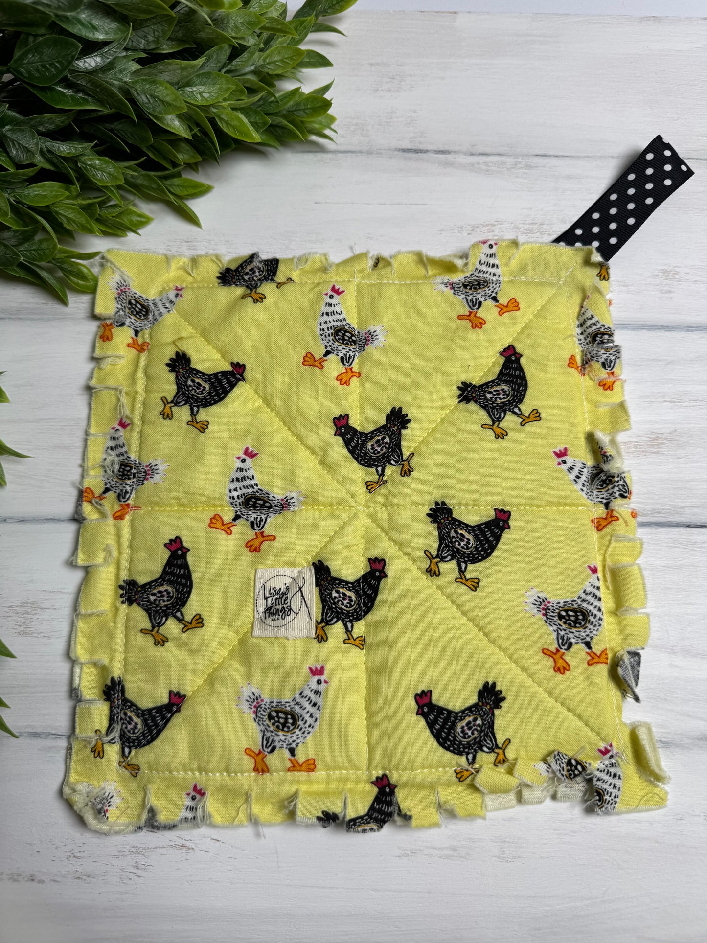 Chickens on yellow potholder