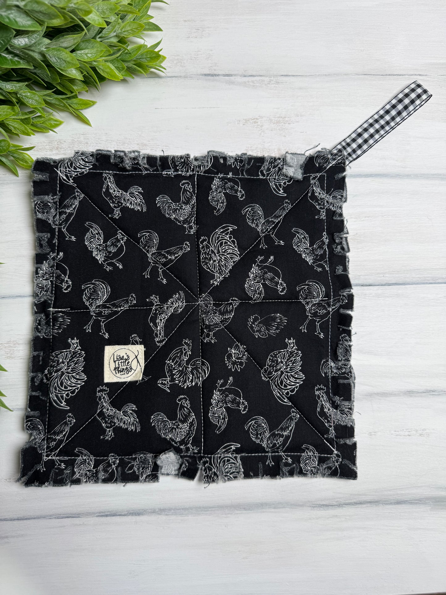 Chickens on black potholder