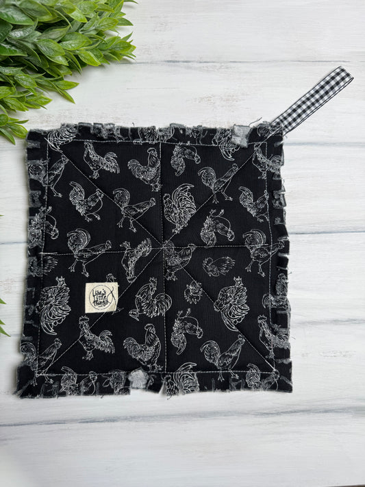 Chickens on black potholder