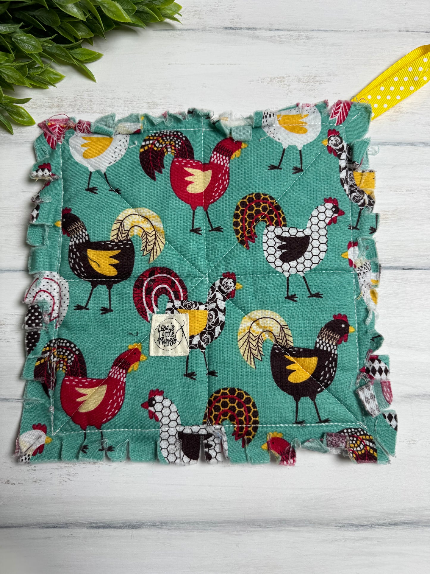 Chickens on green potholder