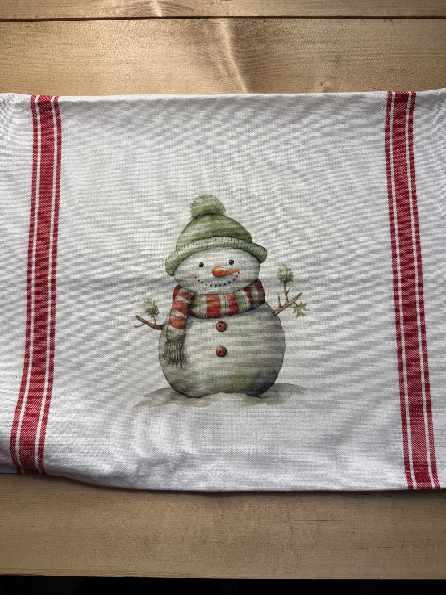 Red and green snowman tea towel