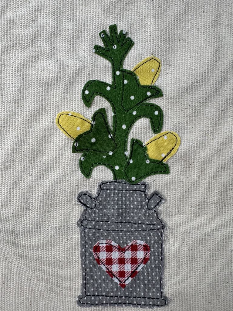 Milk can with cornstalk applique patterns